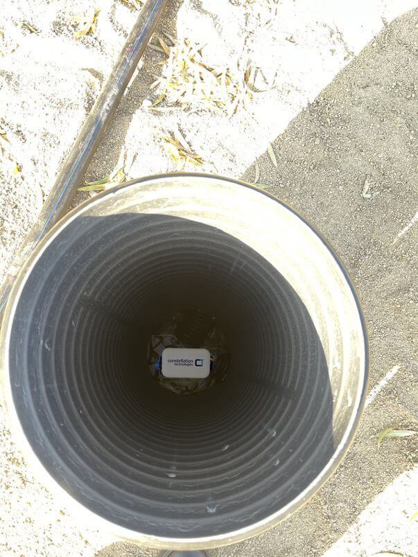 Looking down into a monitoring well with a sensor at the bottom